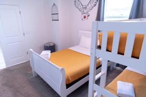 a small bedroom with a bunk bed and a bunk bed at Disney Magic ChampionsGate Resort House 15 min from Disney World, with Club House, 7 Pools and Water Park in Kissimmee +37 photos