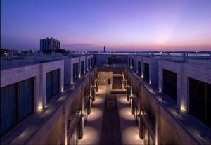 a view of a building at night with the lights on at Kyona gold in Jeddah