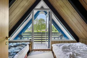 a room with two beds and a window at LL250-Humble-Kystvej-7 in Humble