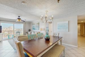 a dining room and living room with a dining table at Anglers Cove 608 in St. Pete Beach