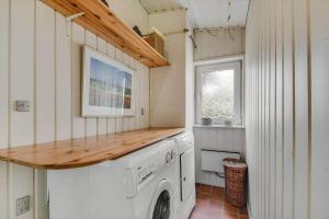 a laundry room with a white washer and dryer at C11663-Hemmet-Mosevaenget-9 in Hemmet