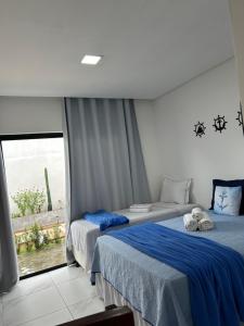 En eller flere senge i et værelse på Pousada Bella Flor + 85 billeder