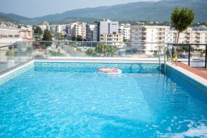 a swimming pool with a toy in the water at Hotel Evropa in Ulcinj