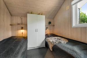 En eller flere senge i et værelse på C11101-Hemmet-Bork-Hytteby-53