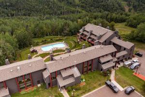 an aerial view of a house with a swimming pool at Fully updated condo ski in ski out hot tub pool in Lutsen