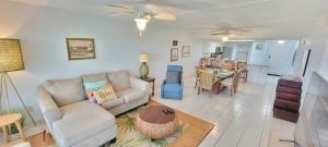 a living room with a couch and a table at Saida Towers II #104 condo in South Padre Island