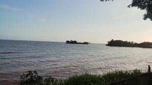 an island in the middle of a large body of water at Hospedagem Beira Mar in Belém