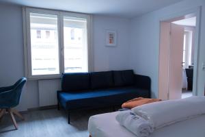 Ένα ή περισσότερα κρεβάτια σε δωμάτιο στο Retro-Modern in der Bregenzer Fussgaengerzone