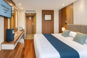 Ένα ή περισσότερα κρεβάτια σε δωμάτιο στο Rene Floating Hotel