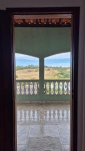 an open door to a balcony with a view at Suíte319 in São José dos Campos