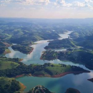 an aerial view of a river with trees and forests at Chicon's Restaurante e Pousada in Igaratá