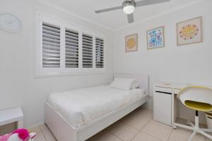 Una cama o camas en una habitación de Pandanus Retreat