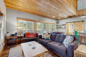 a living room with a couch and a table at Kat'z Place in Neskowin