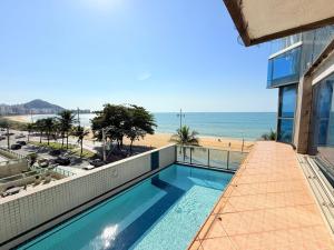 a view of the beach from the balcony of a building at Diamond Beach in Vila Velha