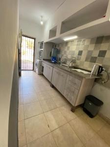 a kitchen with a sink and a counter top at Kingston House in La Rioja