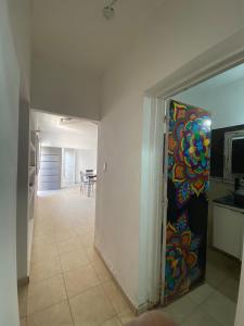 a doorway to a kitchen with a painting on the wall at Kingston House in La Rioja