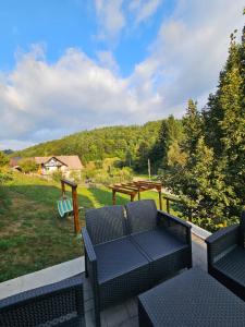 a patio with a couch and a gazebo at Vibe House Madisson in Braşov +13 photos