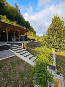 a garden with stairs and a pavilion at Vibe House Madisson in Braşov