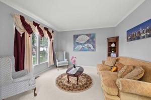 a living room with a couch and a table at Pickerington Haven - Home for 10 in Pickerington