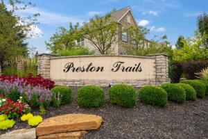 a sign in a garden with flowers and plants at Pickerington Haven - Home for 10 in Pickerington
