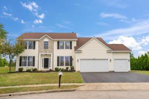 a large white house with a garage at Pickerington Haven - Home for 10 in Pickerington +54 photos