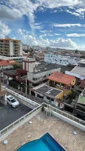a view of a city with a car parked in a parking lot at Studio Luxuoso in Cabo Frio