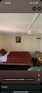 a bedroom with a red bed in a room at Pachamama house in Cusco