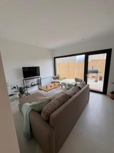 a living room with a couch and a table at Cantera Tempo 2 in Esquel