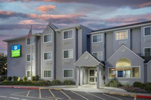 a rendering of the front of a hotel at SureStay by Best Western Sacramento South Natomas in Sacramento