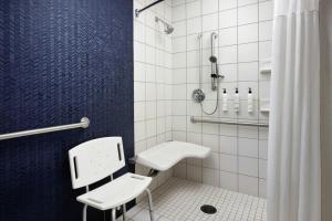 a bathroom with a toilet and a sink and a shower at Fairfield Inn Suites Brunswick in Brunswick +18 photos