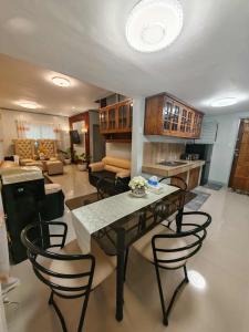 a large living room with a table and chairs at Grace Abode Haven in General Santos