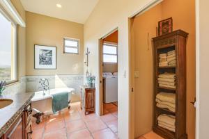 a bathroom with a tub and a sink at The Hideaway - Santa Fe-Style Home in Rio Verde! in Rio Verde +24 photos
