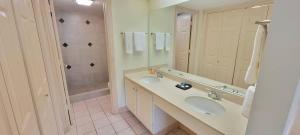 a bathroom with two sinks and a large mirror at Beachfront Resort with Heated Pool Saida Royale 9039 in South Padre Island +168 photos