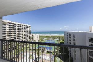 a balcony with a view of the beach and buildings at Saida Towers III- 3101 condo in South Padre Island