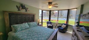 a bedroom with a bed and a large window at Saida Royale 9018 condo in South Padre Island