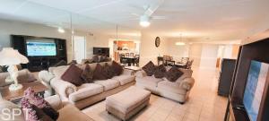 a living room with a couch and a tv at Saida Towers IV #108 condo in South Padre Island