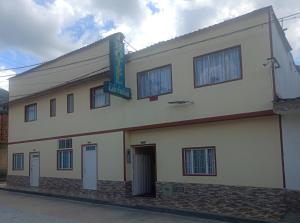 a building with a sign on the side of it at Hotel Las Vegas in Muzo