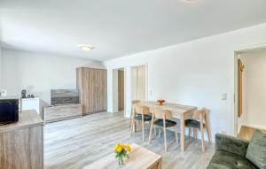 a living room with a table and a couch at Beautiful Apartment In Altenkirchen With Wifi in Altenkirchen