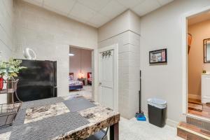 a living room with a large flat screen tv at The Boiler Room - ATV-Friendly Briceville Gem! in Briceville