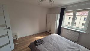 Ένα ή περισσότερα κρεβάτια σε δωμάτιο στο Zagan Apartments #4