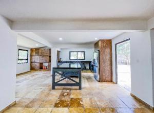 a kitchen with a table in the middle of a room at Villa Lorena es un Lugar Magico para desconectarte in Jalatlaco +66 photos