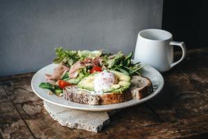 a plate of food with a salad and a cup of coffee at AET & o3 HOTEL in Tokyo