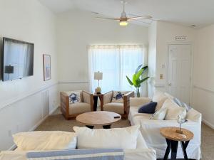 a living room with a couch and a table at Surfside Beach Haven in Surf City