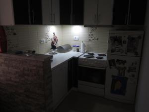 a kitchen with a stove and a refrigerator at Apartment Tea&Lela in Risan