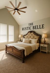 a bedroom with a king sized bed with a rustic bell sign on the wall at The Rustic Belle in Waxahachie