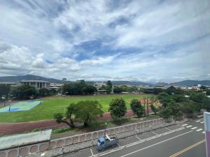 a view of a park with a car parked on the street at 屋子旅店 in Puli