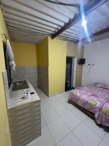 Кровать или кровати в номере Hospedaje Ocasos- Restaurante Mar de brasas +5 фотографий