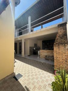 an external view of a house with a roof at Casa Frances in Marechal Deodoro