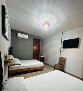 Postel nebo postele na pokoji v ubytování Hotel Ashley