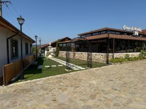 a building with a sign on the side of it at Casa di Nobilis in Gheboieni